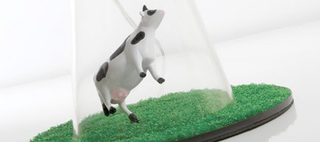 Illustration for article titled A Lamp That Celebrates Alien Cow Abductions Everywhere